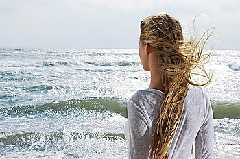 Young Woman Looking at Ocean