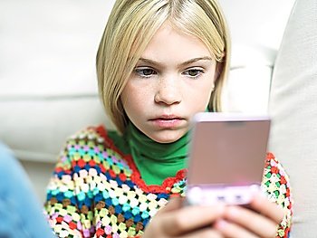Girl Playing Handheld Video Game