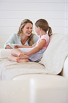 Woman With Daughter on Sofa