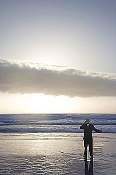Businessman Standing in the Ocean