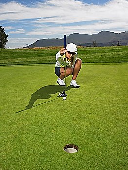 Golfer Lining Up Putt