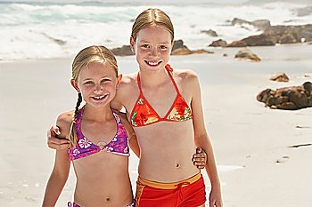 Two girls (7-9 10-12) posing on beach portrait