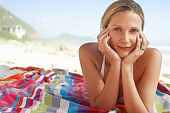 Woman Sunbathing on Beach