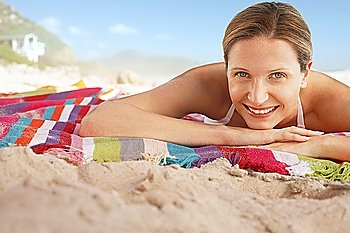 Woman lying on beach portrait