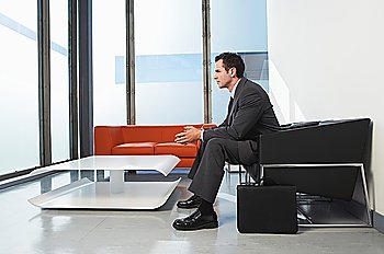 Businessman sitting in waiting room