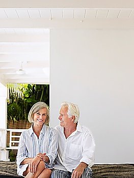 Senior couple sitting on verandah portrait