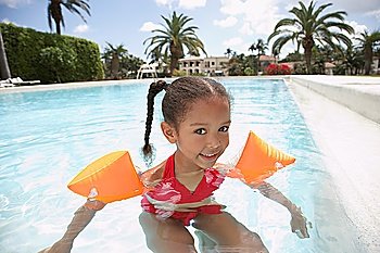 Girl (5-6 years) in swimming pool
