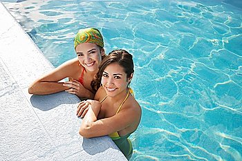 Two teenage girls (16-17) in swimming pool portrait elevated view