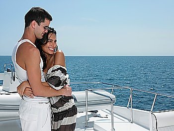 Young couple embracing on yacht