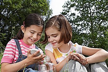 Two Girls with Jar Outside