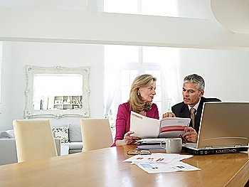 Woman sitting at table with financial advisor