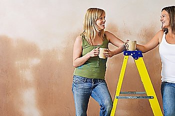 Two Women Having Break from Renovating
