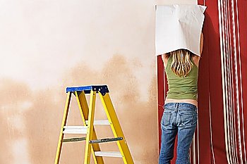 Woman Wallpapering
