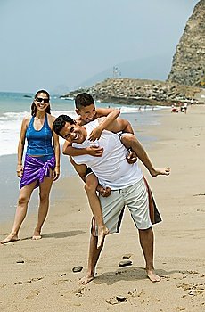 Family Playing on Beach