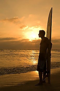 Surfer Enjoying Gorgeous Sunset