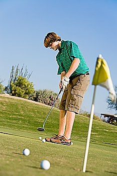 Golfer Putting on Practice Green