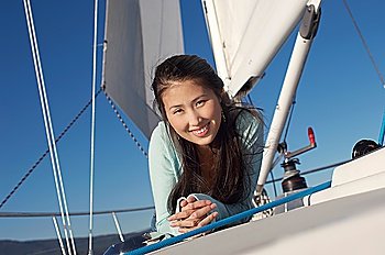 Woman Lying on Sailboat Deck