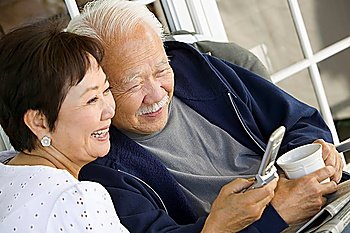Couple Using Cell Phone Together