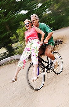 Woman Riding on Handlebars of Man´s Bike
