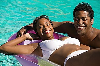 Couple Relaxing in Swimming Pool