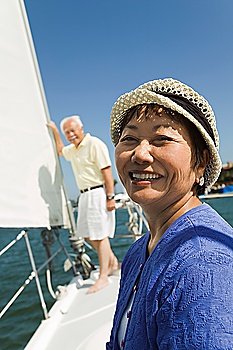Smiling Woman and Husband on Sailboat