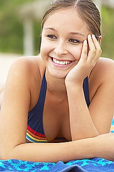 Happy Young Woman Relaxing on Beach