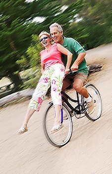 Woman Riding on Handlebars of Man´s Bike