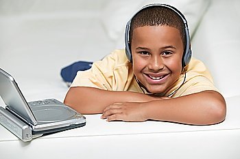 Smiling Boy Watching Portable DVD Player