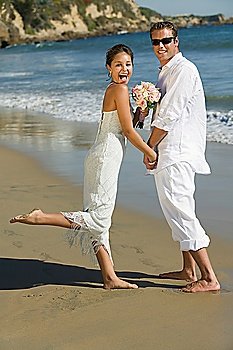 Excited Bride and Groom on Beach