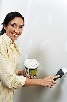 Woman Spackling Wall