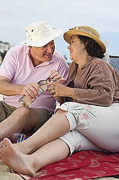 Senior couple drinking wine and looking in eyes