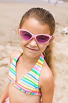 Portrait of girl on beach, smiling