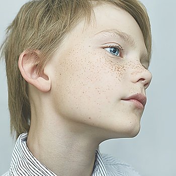 portrait of a handsome boy with freckles, art close-up portrait