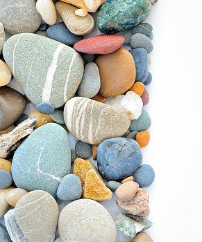 colored stones on white background on white background