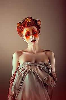 Portrait of Unusual Redhead Woman with False Red Eyelashes. Fantasy