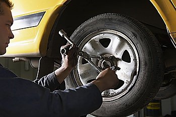 Mechanic Working on Tire