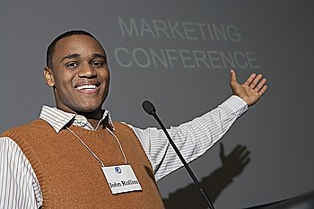 Business man giving presentation at conference meeting, portrait