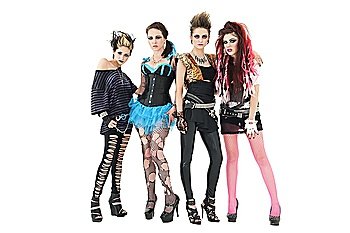Portrait of all female rock band posing together over white background