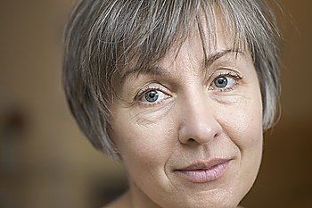 Portrait of mature woman with short grey hair