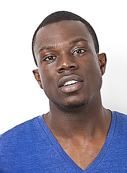 Portrait of young African American man against white background