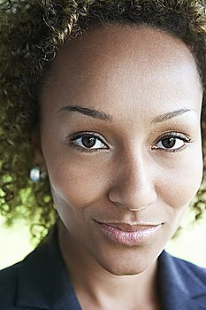 Woman smiling, outdoors, close-up, portrait
