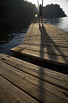Person exercising on jetty