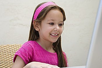 Little Girl Using a Laptop
