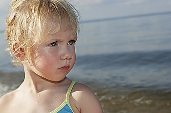 Young girl (3-4) at ocean