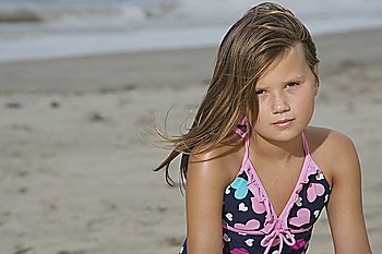 Little Girl Sitting on a Beach