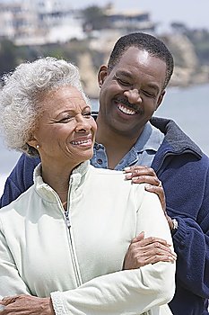 Senior woman with mature man on beach