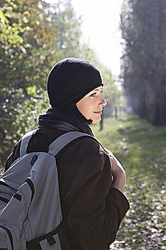 Young woman in winter clothing at park