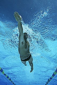 Male swimmer in pool, underwater view