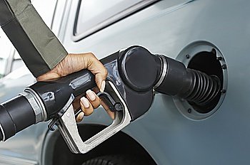 Woman pumping gas, close up of hand