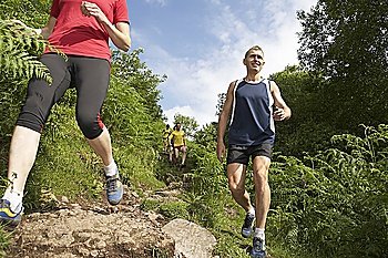 Joggers Running on Trail